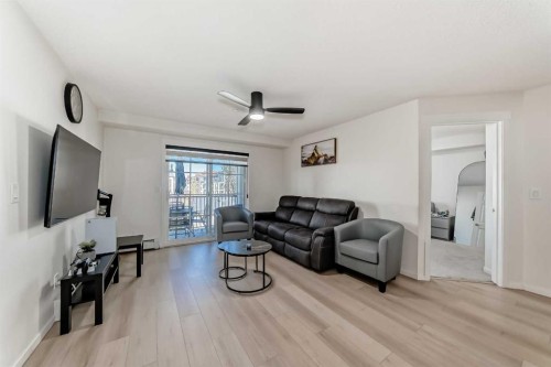 1312-755 Copperpond Boulevard Se, Calgary, AB - Indoor Photo Showing Living Room
