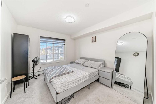 1312-755 Copperpond Boulevard Se, Calgary, AB - Indoor Photo Showing Bedroom