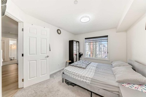 1312-755 Copperpond Boulevard Se, Calgary, AB - Indoor Photo Showing Bedroom