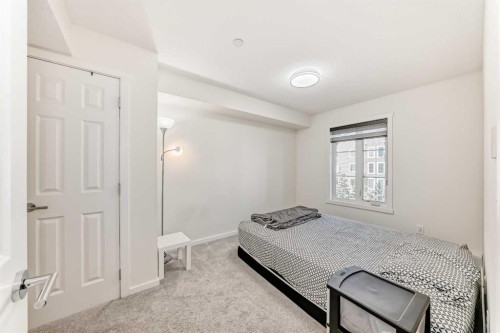 1312-755 Copperpond Boulevard Se, Calgary, AB - Indoor Photo Showing Bedroom