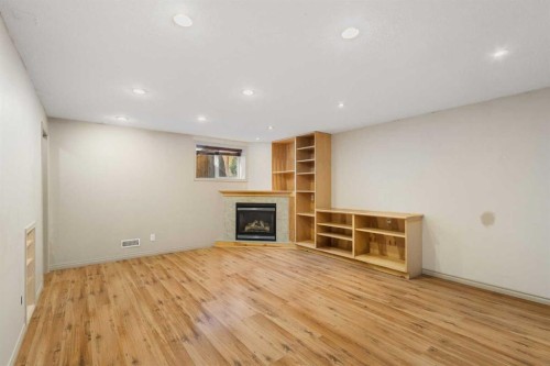 252 Prestwick Heights Se, Calgary, AB - Indoor Photo Showing Other Room With Fireplace