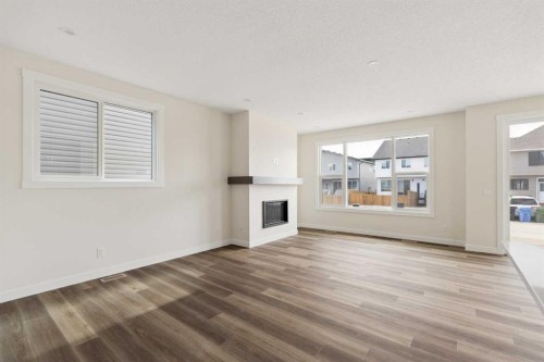 120 Creekstone Circle Sw, Calgary, AB - Indoor Photo Showing Living Room With Fireplace