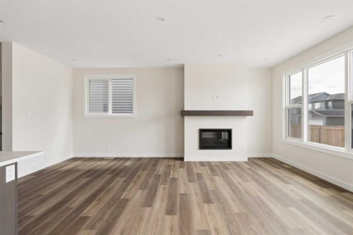 120 Creekstone Circle Sw, Calgary, AB - Indoor Photo Showing Living Room With Fireplace