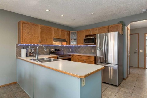 159 Macewan Drive Nw, Calgary, AB - Indoor Photo Showing Kitchen With Double Sink