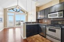 11-148 Rockyledge View Nw, Calgary, AB  - Indoor Photo Showing Kitchen With Double Sink 