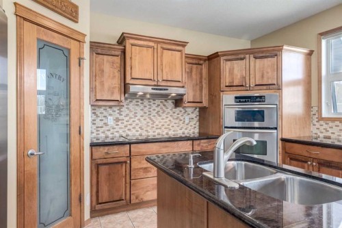 15 Barber Street Nw, Langdon, AB - Indoor Photo Showing Kitchen With Double Sink