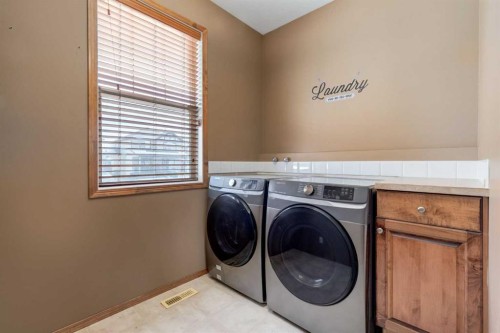 15 Barber Street Nw, Langdon, AB - Indoor Photo Showing Laundry Room