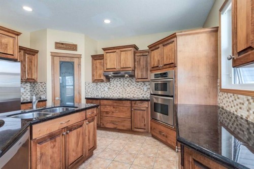 15 Barber Street Nw, Langdon, AB - Indoor Photo Showing Kitchen With Double Sink