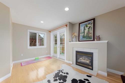 1239 Beverley Boulevard Sw, Calgary, AB - Indoor Photo Showing Living Room With Fireplace