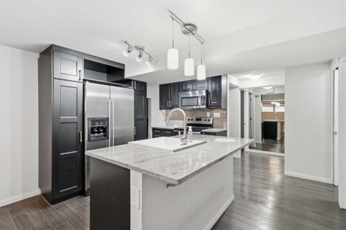 95 Summerwood Road, Airdrie, AB - Indoor Photo Showing Kitchen With Upgraded Kitchen