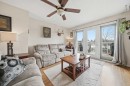 95 Summerwood Road, Airdrie, AB  - Indoor Photo Showing Living Room 