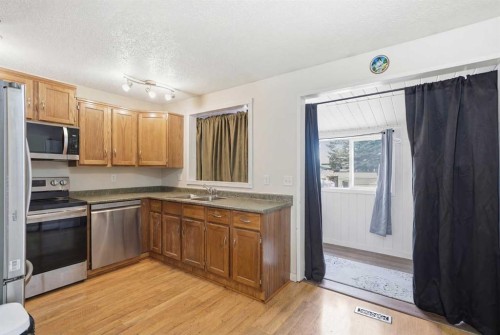 95 Summerwood Road, Airdrie, AB - Indoor Photo Showing Kitchen With Double Sink