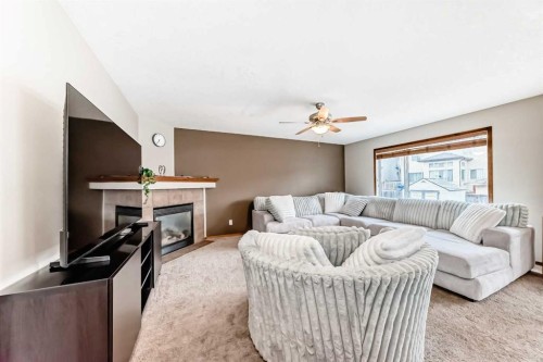 225 Kincora Heights Nw, Calgary, AB - Indoor Photo Showing Bedroom With Fireplace