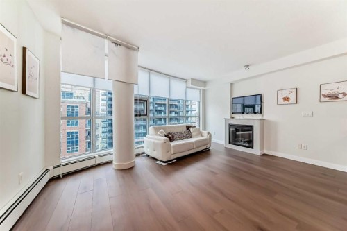 1002-735 2 Avenue Sw, Calgary, AB - Indoor Photo Showing Living Room With Fireplace