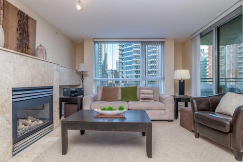 404-1108 6 Avenue Sw, Calgary, AB - Indoor Photo Showing Living Room With Fireplace