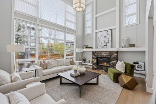81 West Point Close Sw, Calgary, AB - Indoor Photo Showing Living Room With Fireplace