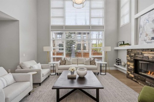 81 West Point Close Sw, Calgary, AB - Indoor Photo Showing Living Room With Fireplace