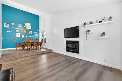 236 Mckerrell Way Se, Calgary, AB - Indoor Photo Showing Living Room With Fireplace