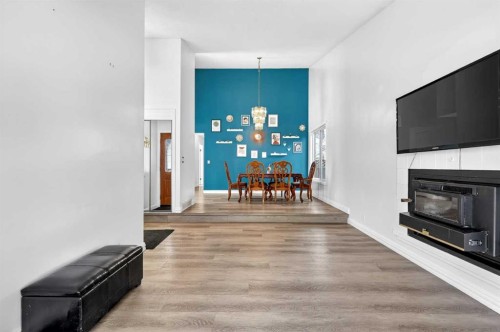 236 Mckerrell Way Se, Calgary, AB - Indoor Photo Showing Living Room With Fireplace