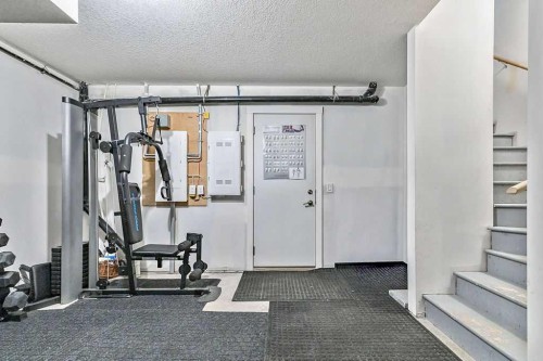 305 Cranbrook Walk Se, Calgary, AB - Indoor Photo Showing Gym Room