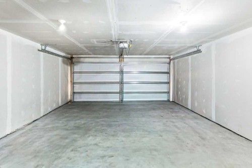 305 Cranbrook Walk Se, Calgary, AB - Indoor Photo Showing Garage