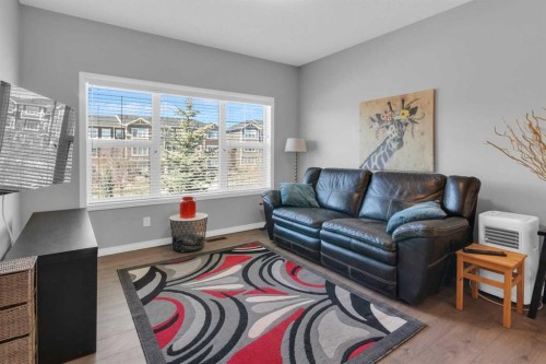 188 Sundown Road, Cochrane, AB - Indoor Photo Showing Living Room