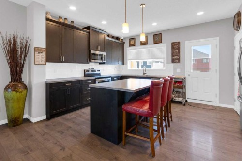188 Sundown Road, Cochrane, AB - Indoor Photo Showing Kitchen With Upgraded Kitchen