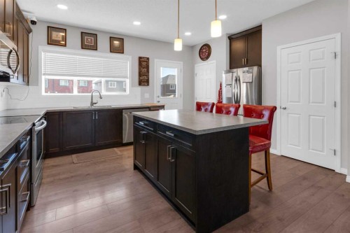 188 Sundown Road, Cochrane, AB - Indoor Photo Showing Kitchen With Upgraded Kitchen