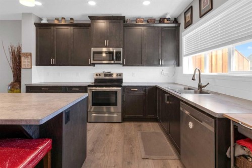188 Sundown Road, Cochrane, AB - Indoor Photo Showing Kitchen With Stainless Steel Kitchen With Double Sink