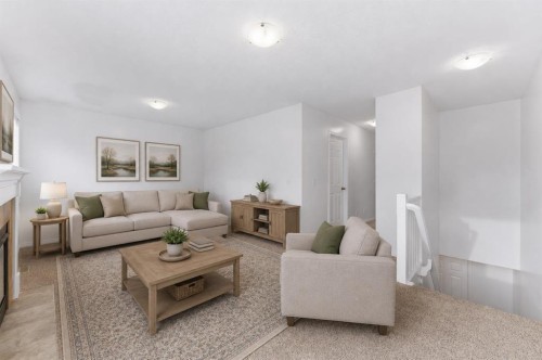 547 Windstone Common Sw, Airdrie, AB - Indoor Photo Showing Living Room With Fireplace
