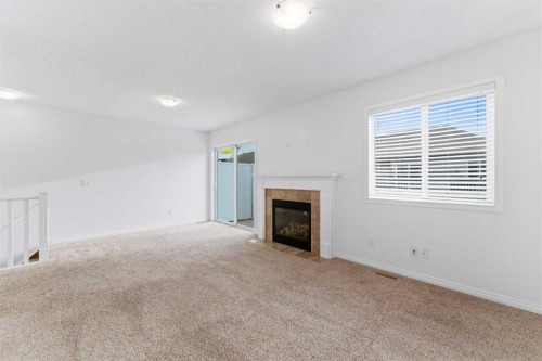 547 Windstone Common Sw, Airdrie, AB - Indoor With Fireplace