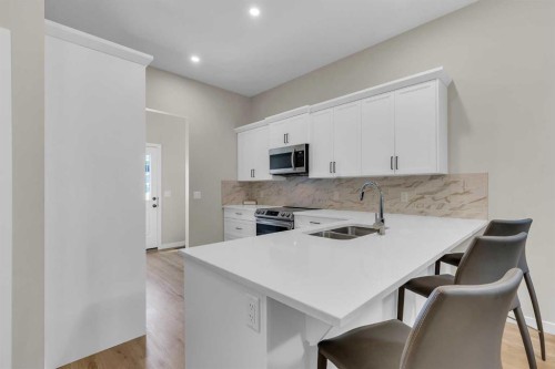 146 Highview Gate Se, Airdrie, AB - Indoor Photo Showing Kitchen With Double Sink