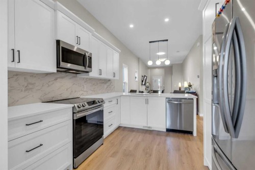 146 Highview Gate Se, Airdrie, AB - Indoor Photo Showing Kitchen With Stainless Steel Kitchen With Upgraded Kitchen