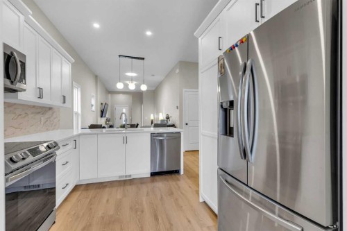 146 Highview Gate Se, Airdrie, AB - Indoor Photo Showing Kitchen With Stainless Steel Kitchen With Upgraded Kitchen