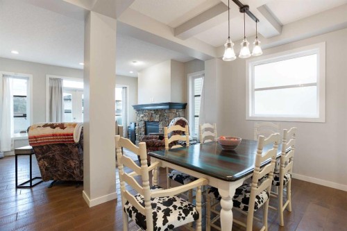 4827 22 Avenue Nw, Calgary, AB - Indoor Photo Showing Dining Room With Fireplace