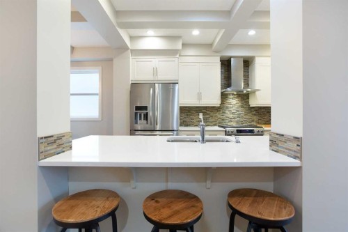 4827 22 Avenue Nw, Calgary, AB - Indoor Photo Showing Kitchen With Double Sink With Upgraded Kitchen
