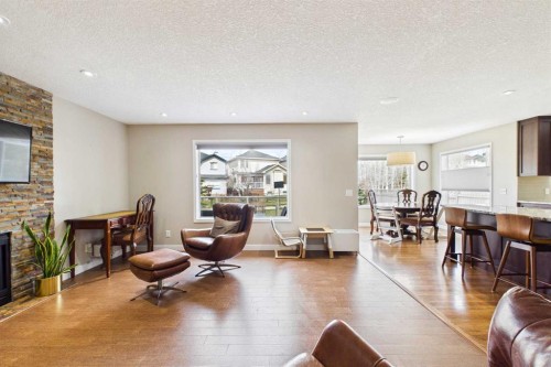 149 Tuscany Ravine Bay Nw, Calgary, AB - Indoor Photo Showing Living Room With Fireplace