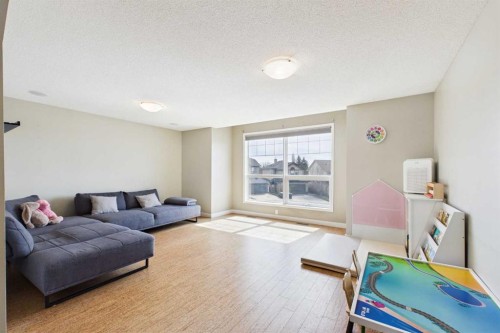 149 Tuscany Ravine Bay Nw, Calgary, AB - Indoor Photo Showing Living Room