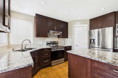 149 Tuscany Ravine Bay Nw, Calgary, AB - Indoor Photo Showing Kitchen With Double Sink With Upgraded Kitchen