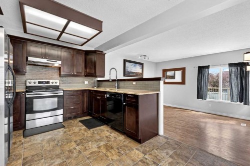 32 Millrise Crescent Sw, Calgary, AB - Indoor Photo Showing Kitchen With Stainless Steel Kitchen With Upgraded Kitchen