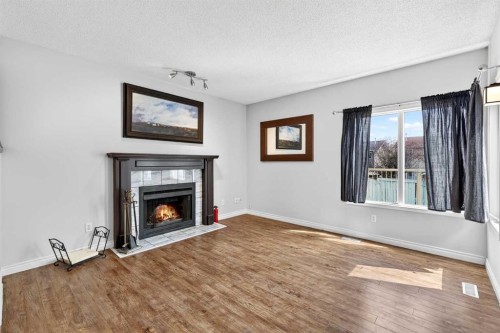 32 Millrise Crescent Sw, Calgary, AB - Indoor Photo Showing Living Room With Fireplace
