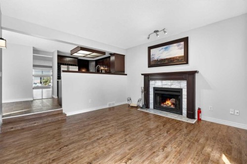 32 Millrise Crescent Sw, Calgary, AB - Indoor Photo Showing Living Room With Fireplace