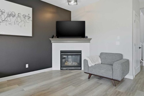115 Everwoods Park Sw, Calgary, AB - Indoor Photo Showing Living Room With Fireplace