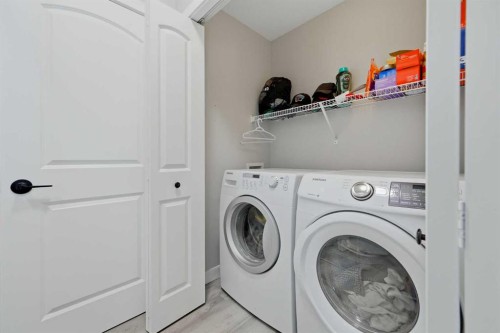 115 Everwoods Park Sw, Calgary, AB - Indoor Photo Showing Laundry Room