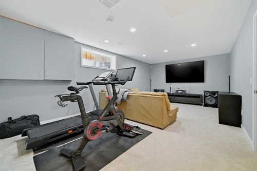 115 Everwoods Park Sw, Calgary, AB - Indoor Photo Showing Gym Room