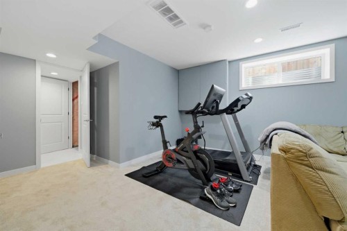 115 Everwoods Park Sw, Calgary, AB - Indoor Photo Showing Gym Room