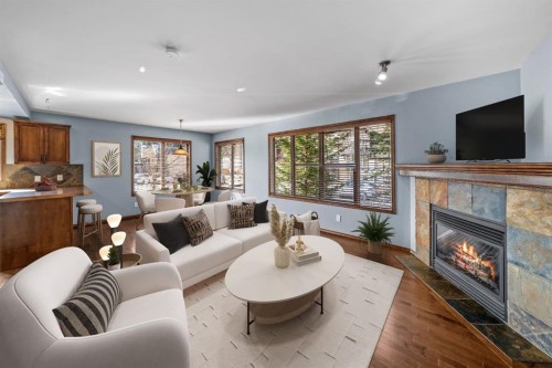 503-108 Armstrong Place, Canmore, AB - Indoor Photo Showing Living Room With Fireplace
