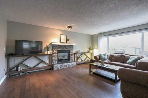 121 Chaparral Way Se, Calgary, AB - Indoor Photo Showing Living Room With Fireplace
