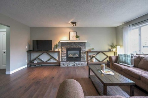 121 Chaparral Way Se, Calgary, AB - Indoor Photo Showing Living Room With Fireplace