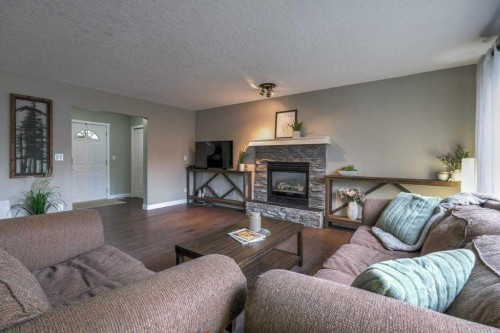 121 Chaparral Way Se, Calgary, AB - Indoor Photo Showing Living Room With Fireplace